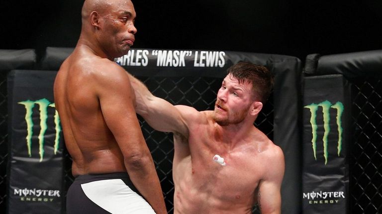 Michael Bisping of knocks out the gumshield of