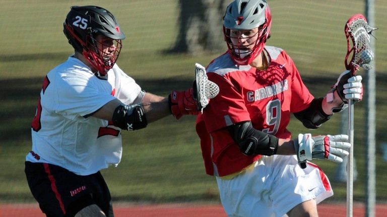 Brendan Damm #9 drives past Ohio Wesleyan's