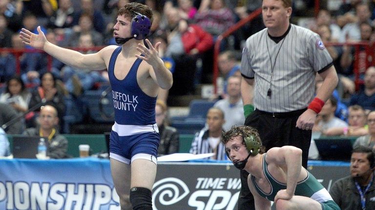 Port Jefferson's Matteo DeVincenzo, left, wins against