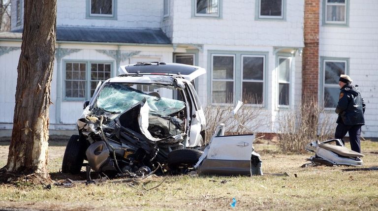 A Suffolk County police officer looks over a