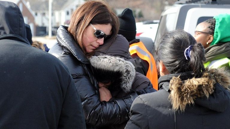 Ivette Salmon, right, mother of Gerson Salmon-Negron, is
