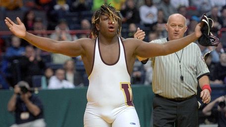 Walt Whitman's Terron Robinson celebrates his win in