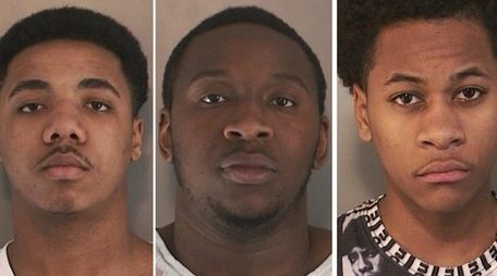 Anthony Morris, 16, left, Charles Siebert, 22, and