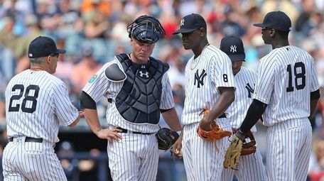 Joe Girardi takes the ball from starting pitcher