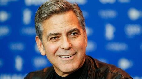 Actor George Clooney attends a press conference for