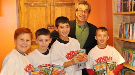 Author Chris Grabenstein poses with Kidsday reporters, from