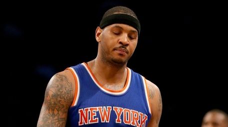 Carmelo Anthony walks off the court late