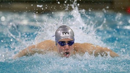Syosset's Tamir Zitelny swims in the 100-yard butterfly