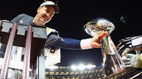 Peyton Manning of the Denver Broncos holds the