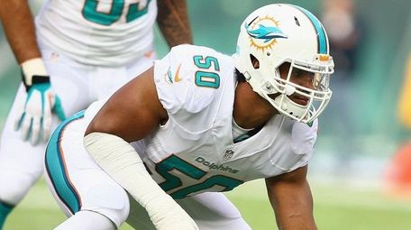 Olivier Vernon of the Miami Dolphins gets in