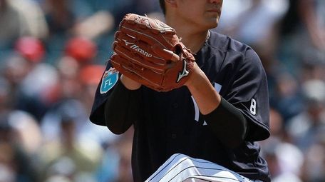 New York Yankees' Masahiro Tanaka throws a pitch
