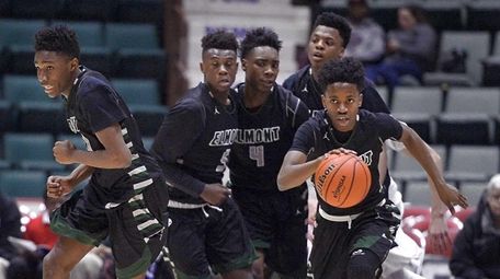 Elmont's Victor Olawoye, right, starts the team on