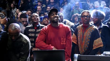 Kanye West performs during the showing of his