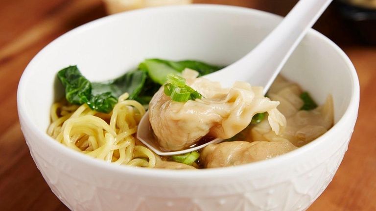 Bok choy and scallions join chicken wontons at
