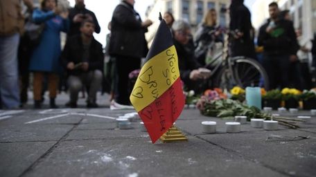 A Belgian flag reading "We are all Brussels"