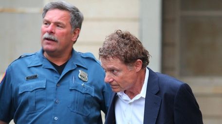 Marshall Hubsher leaves Nassau Police headquarters on Thursday,