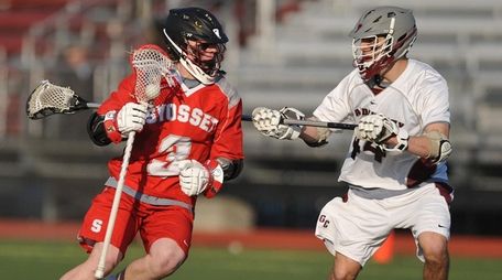 Macaire O'Keefe #3 of Syosset, left, gets