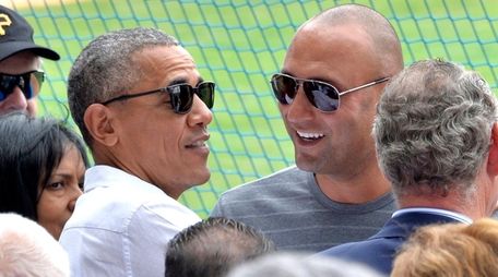 U.S. President Barack Obama speaks with former Yankees