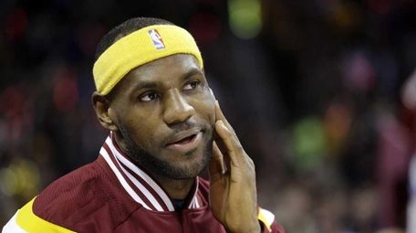 Cleveland Cavaliers' LeBron James watches his team