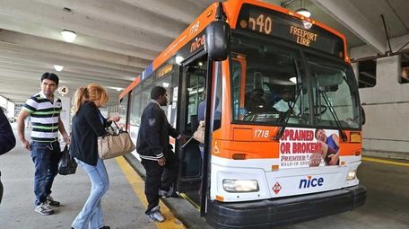 A NICE (Nassau Inter-County Express) bus picks