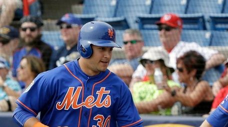 Michael Conforto receives congratulations from Eric Campbell