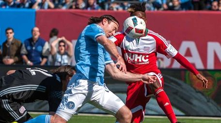 NYCFC's Thomas McNamara (15, center), with the header