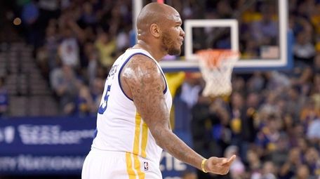 Marreese Speights of the Golden State Warriors reacts