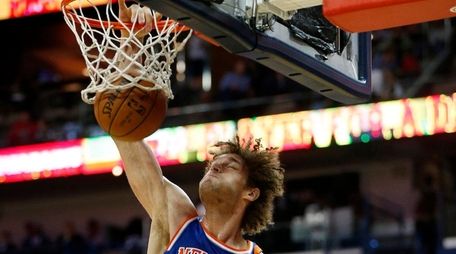 New York Knicks center Robin Lopez dunks in