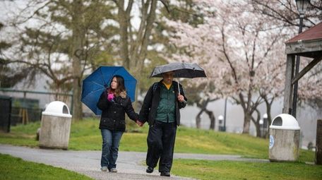 Fred Madjidi, of East Northport, walks with his