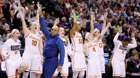 Syracuse coach Quentin Hillsman celebrates a three-pointer in
