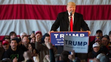 Republican presidential candidate Donald Trump speaks in front