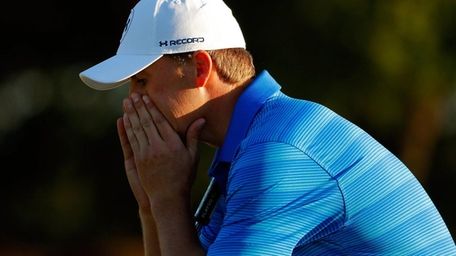 Jordan Spieth reacts after finishing on the 18th