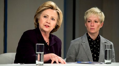 Hillary Clinton, left, with Megan Rapinoe, of the