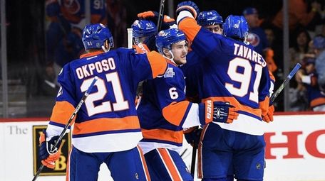 New York Islanders players celebrate a power