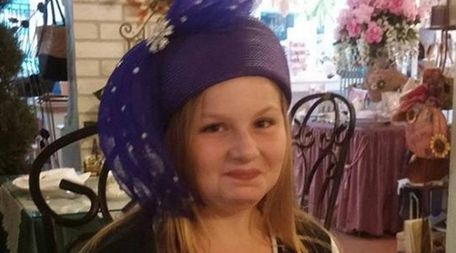 Kidsday reporter Ella Kurth tries on a hat