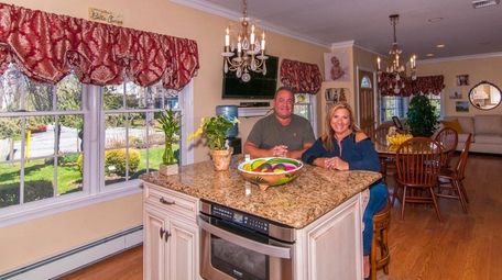 Maryellen and Hank Kobrin in the kitchen of