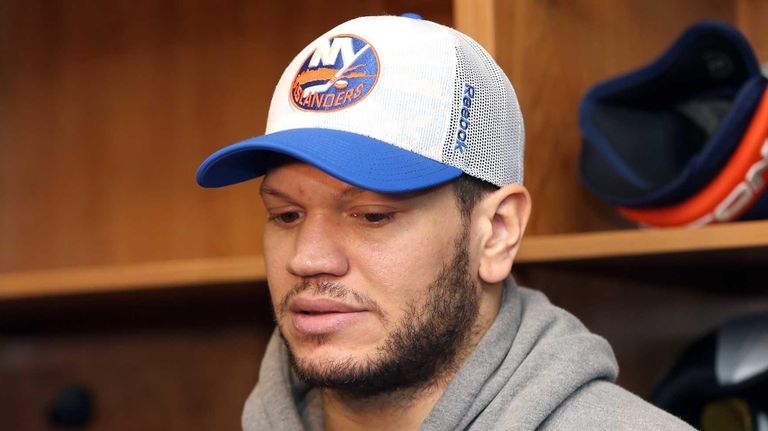 Kyle Okposo talks to members of the media