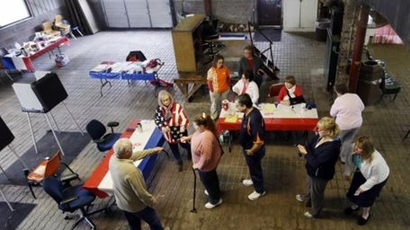 Voters wait to cast their ballot in the