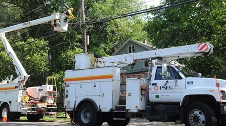 A PSEG Long Island utility worker works on