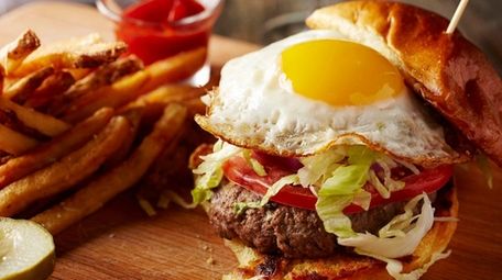 The burger with fried egg on brioche is