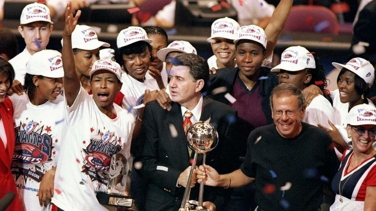 The Houston Comets celebrate after the WNBA championship