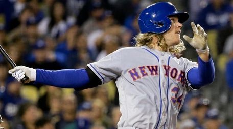 Mets pitcher Noah Syndergaard watches his three-run home
