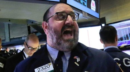 Specialist Peter Giacchi calls out prices on the