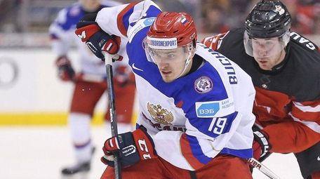 Pavel Buchnevich of Team Russia tries to break