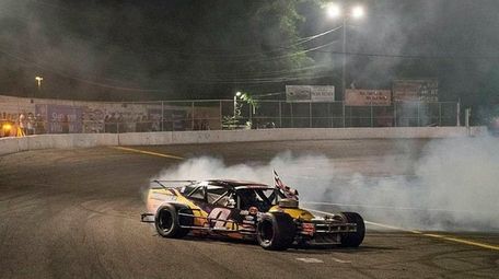 Tom Rogers Jr., of Riverhead, puts on a