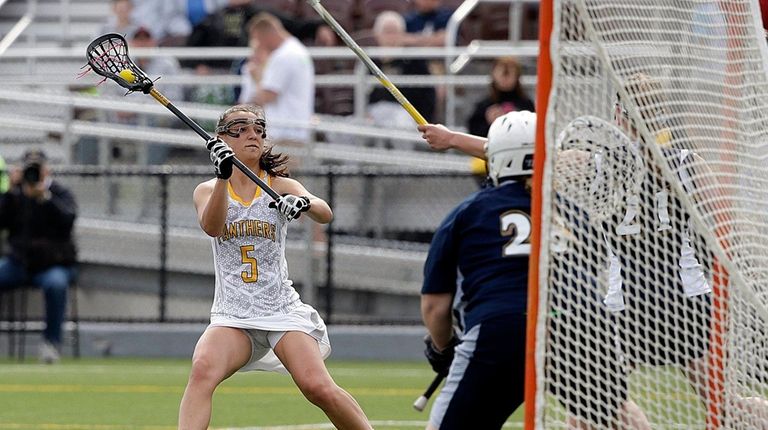 Adelphi attacker Jacqueline Jahelka (5) winds up for