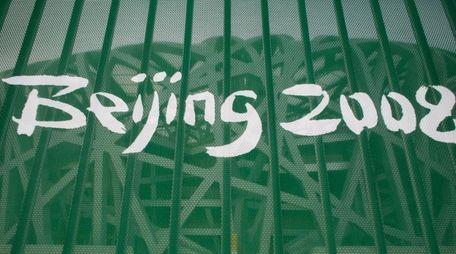 A protective fence with a Beijing 2008 logo