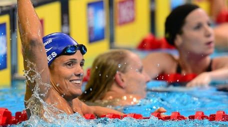 Dara Torres, 45, (L) celebrates her second place