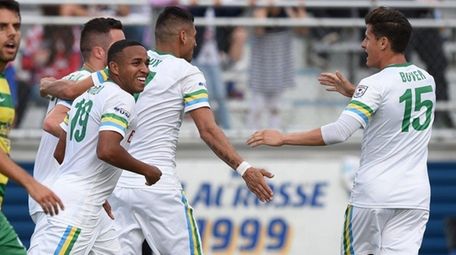 The New York Cosmos celebrate a goal by