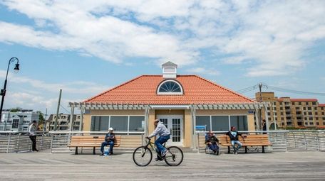 Visitors to Long Beach wander past a comfort